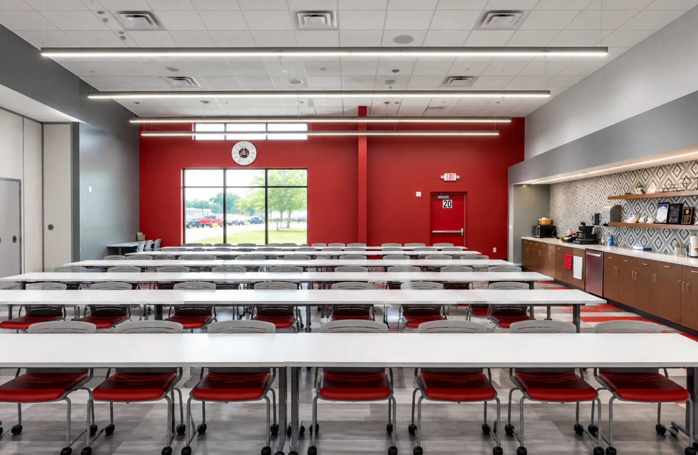 A Cardinal Glass Industries training room set with tables and seating for a continuing-education session